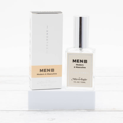 Men’s II (Modern & Masculine) Cologne Spray in clear 30 mL bottle with white and beige box. Size: 30 mL.