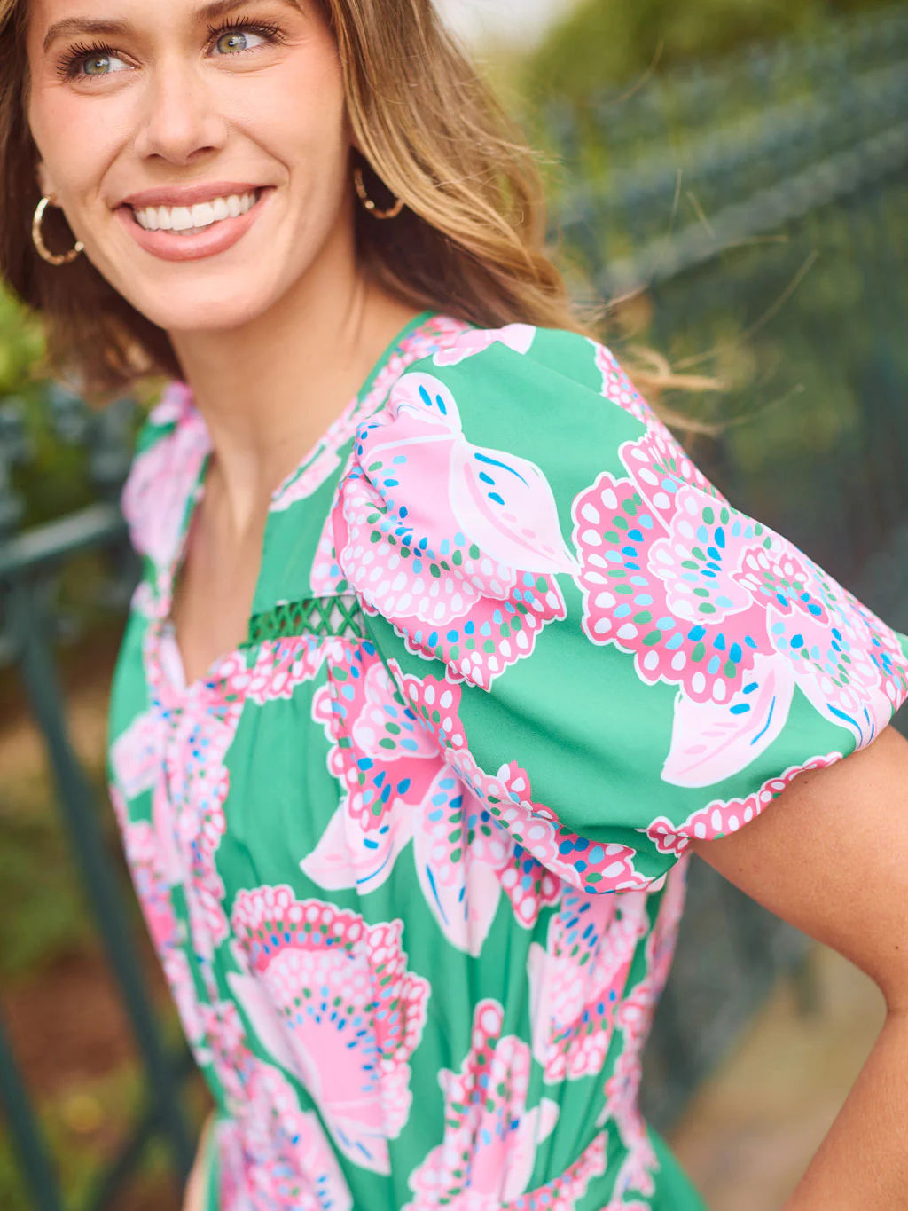 Addison Petal Tango Green Dress with pink and blue floral print, bubble sleeves, tie belt; available in sizes XS–XL.