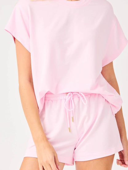 Emily Pink Set: relaxed fit, light pink short-sleeve tee and drawstring shorts. Available in sizes XS–XL.