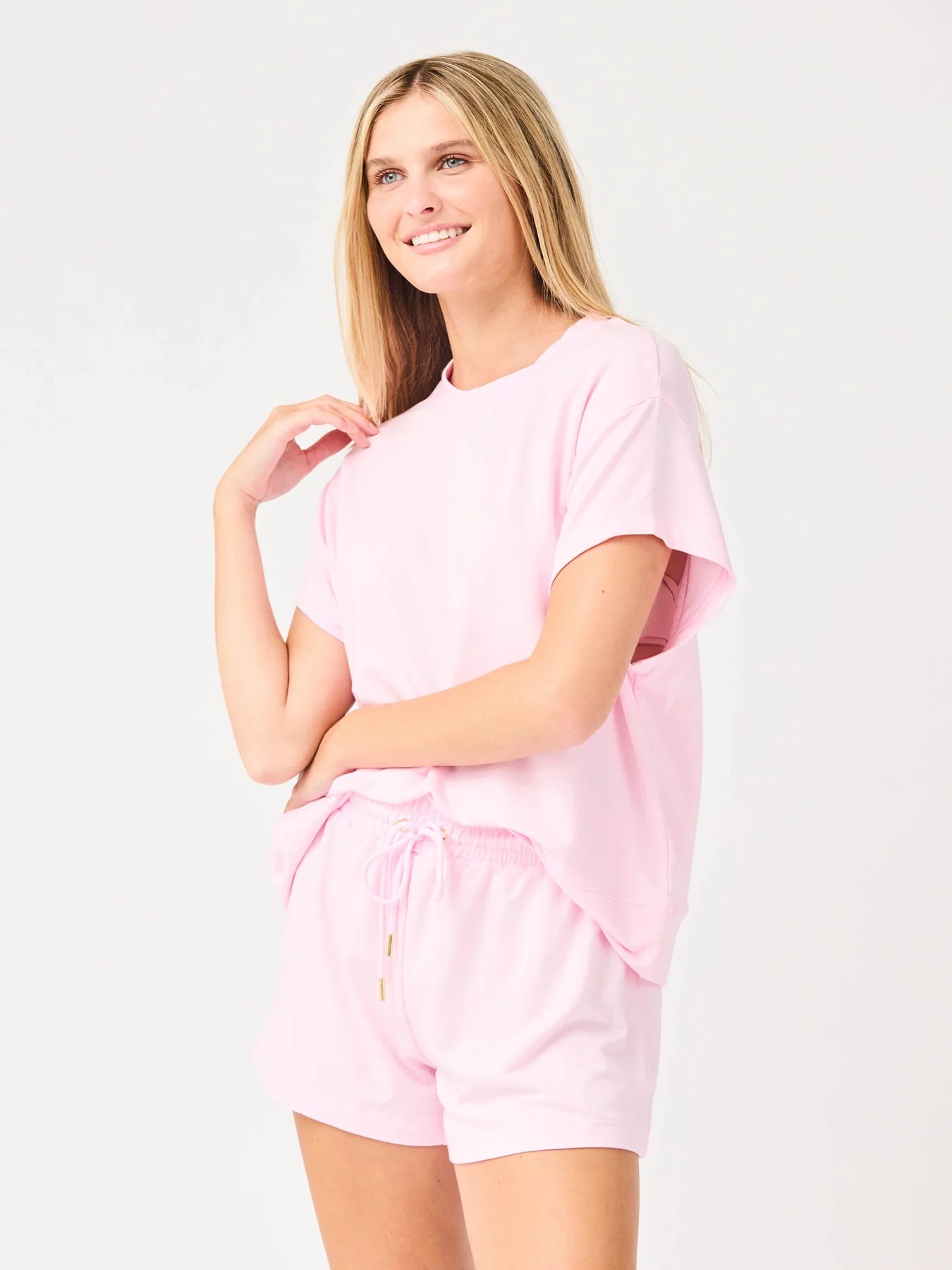 Light pink short-sleeve t-shirt and drawstring shorts set. Emily Pink Set available in sizes XS–XL.
