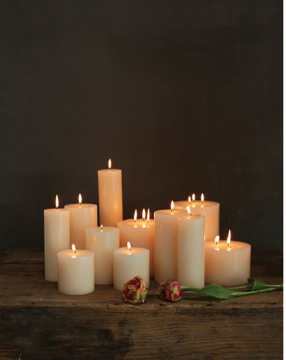Lit Flaire Unscented Pillar Candles, various heights. Available sizes: small, medium, large. For long-lasting use.