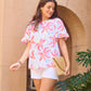Cassidy Hibiscus Harmony White Top with crew neckline. Available in sizes XS–XL.