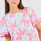 Cassidy Hibiscus Harmony White Top: short sleeves, crew neck, pink floral print, ruffled edges. Sizes XS-XL.