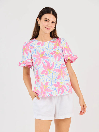Cassidy Hibiscus Harmony White Top: floral short-sleeves, ruffled edges, scallop trim, crew neck. Available in XS-XL.