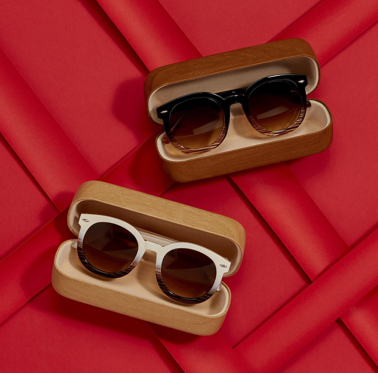 Two pairs of Fade Frame Sunglasses, each in open wooden cases. UV400 protection. Top pair: dark brown frames. Bottom pair: white ombre frames. Sizes available: One size fits most.