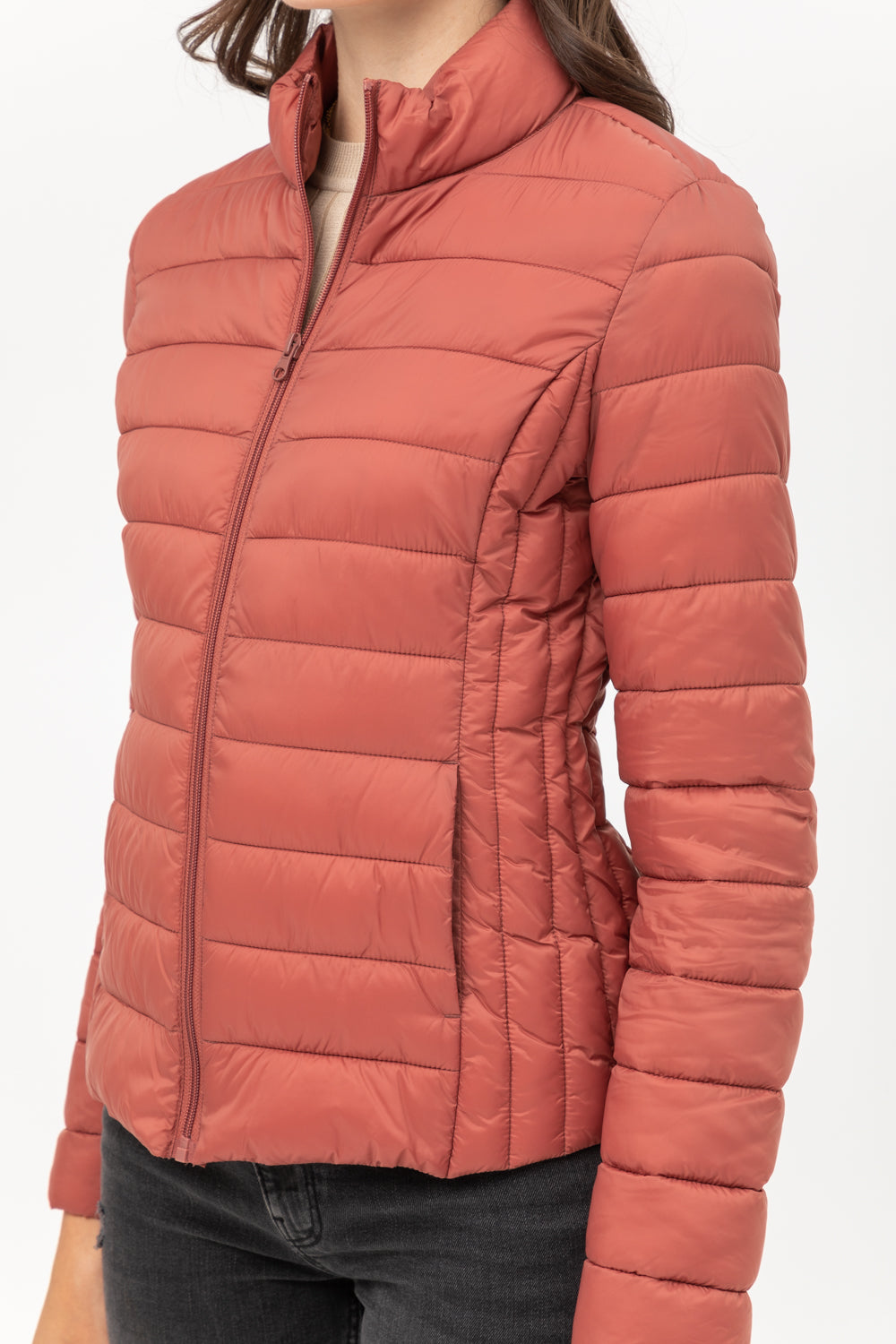 Ultra Lightweight Padded Thermal Zip Up Jacket in salmon. Features a high collar. Available in sizes XS-XXL.