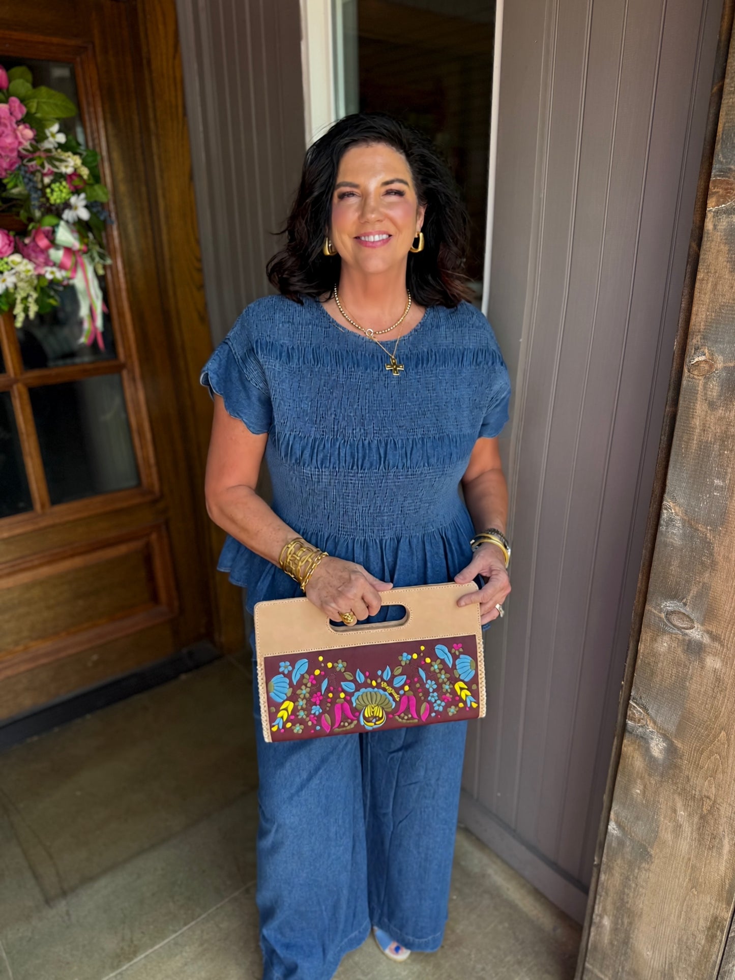 Blaire Chambray Smocked Peplum Top with scalloped ruffle sleeves; available in sizes XS-XL.