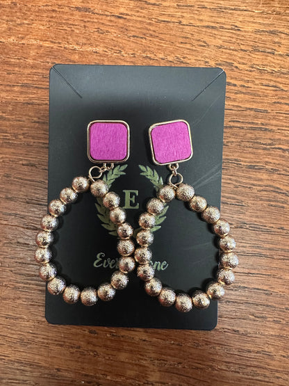 Square purple tops with large metallic, textured bead loops. Available in small, medium, and large sizes.
