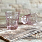 Set of two pink pressed glass Marseille & Remi Blush tumblers; available in 8oz and 12oz sizes.