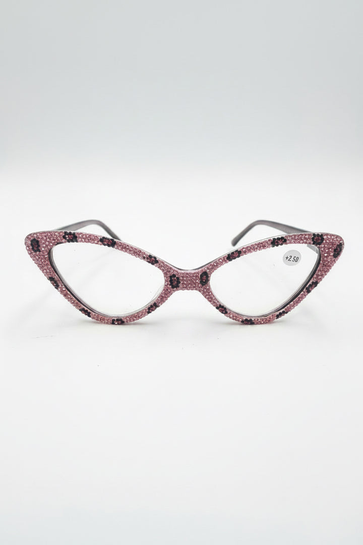 Pink cat-eye glitter eyeglasses with clear lenses, black spots, rhinestones. Available in +2.50 and other sizes.