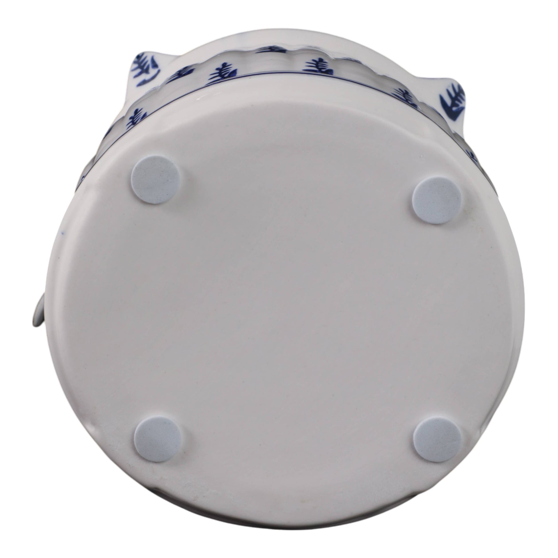 Flat bottom of 8 in. White/Blue Chinoiserie Pagoda Birdhouse with four pads and blue pattern at edge.