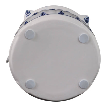 Flat bottom of 8 in. White/Blue Chinoiserie Pagoda Birdhouse with four pads and blue pattern at edge.