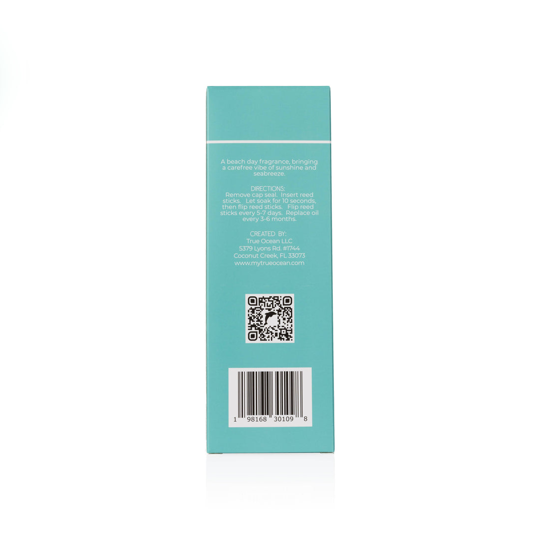 Back of turquoise True Ocean Reed Diffuser box, white text, QR code, barcode. Coastal scent. Sizes: not specified.