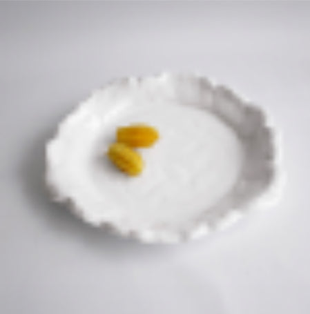 Vida Havana Extra Large Round Platter with a textured, uneven edge; also available in other sizes.