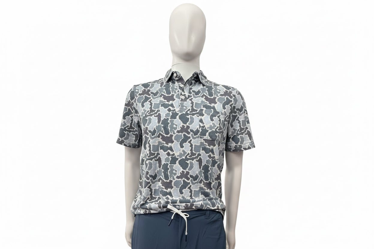 Short-sleeve, collared polo with gray, white, and blue abstract camo pattern. Sizes: S-XXL.