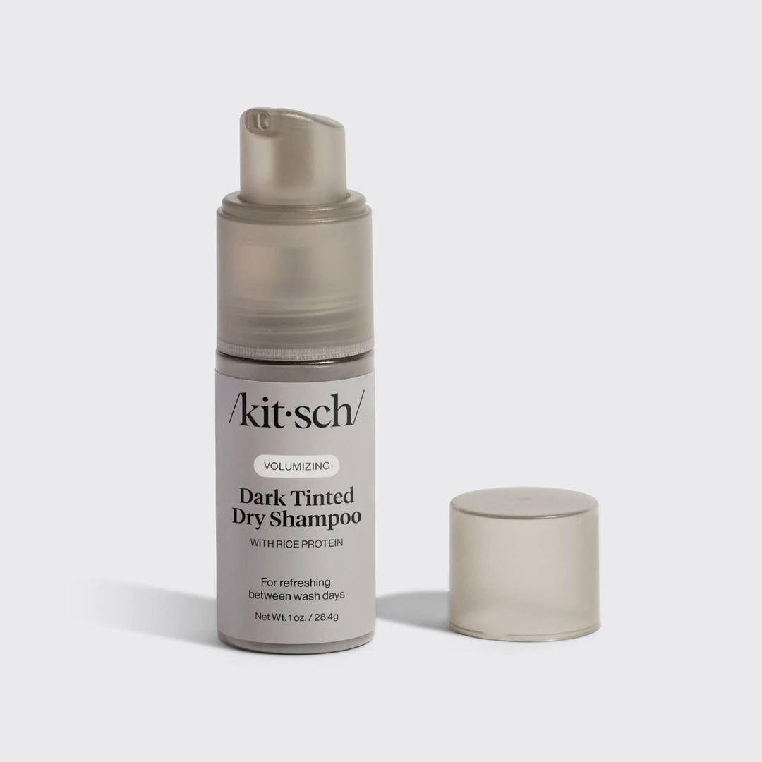 Volumizing Rice Protein Dry Shampoo - Dark Tinted, 1 oz bottle with cap off, brown-tinted non-aerosol powder visible.