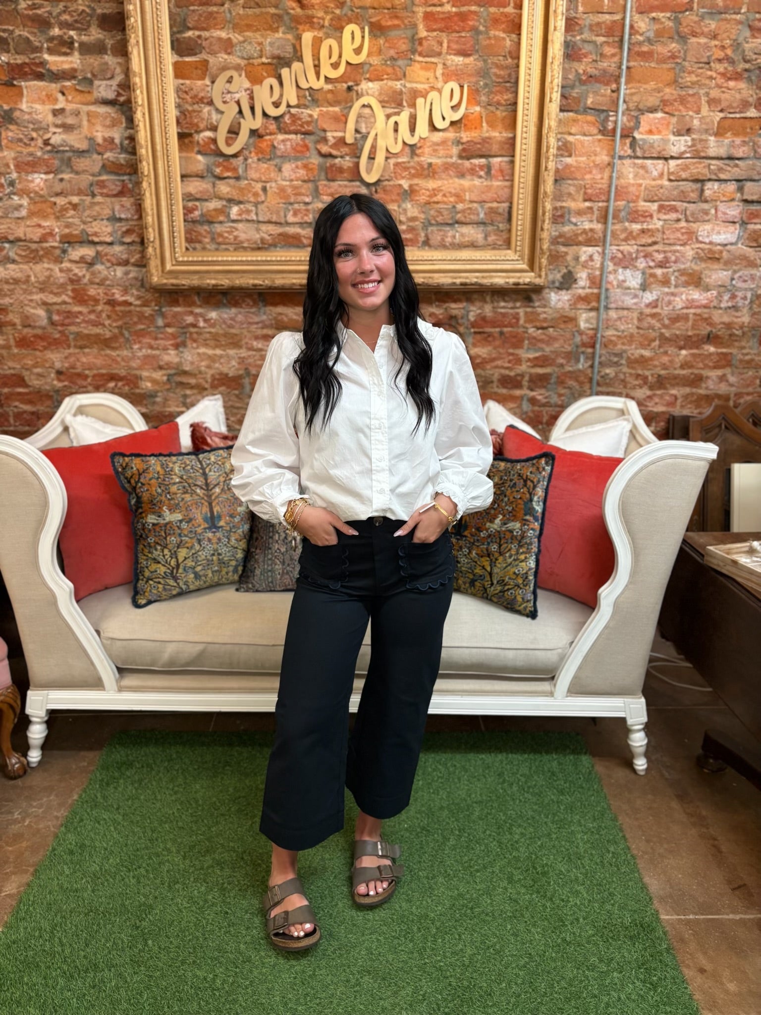 Off-White Ruffle Collar Button-Up Blouse. Available in sizes XS–XL. Features ruffle collar and front buttons.
