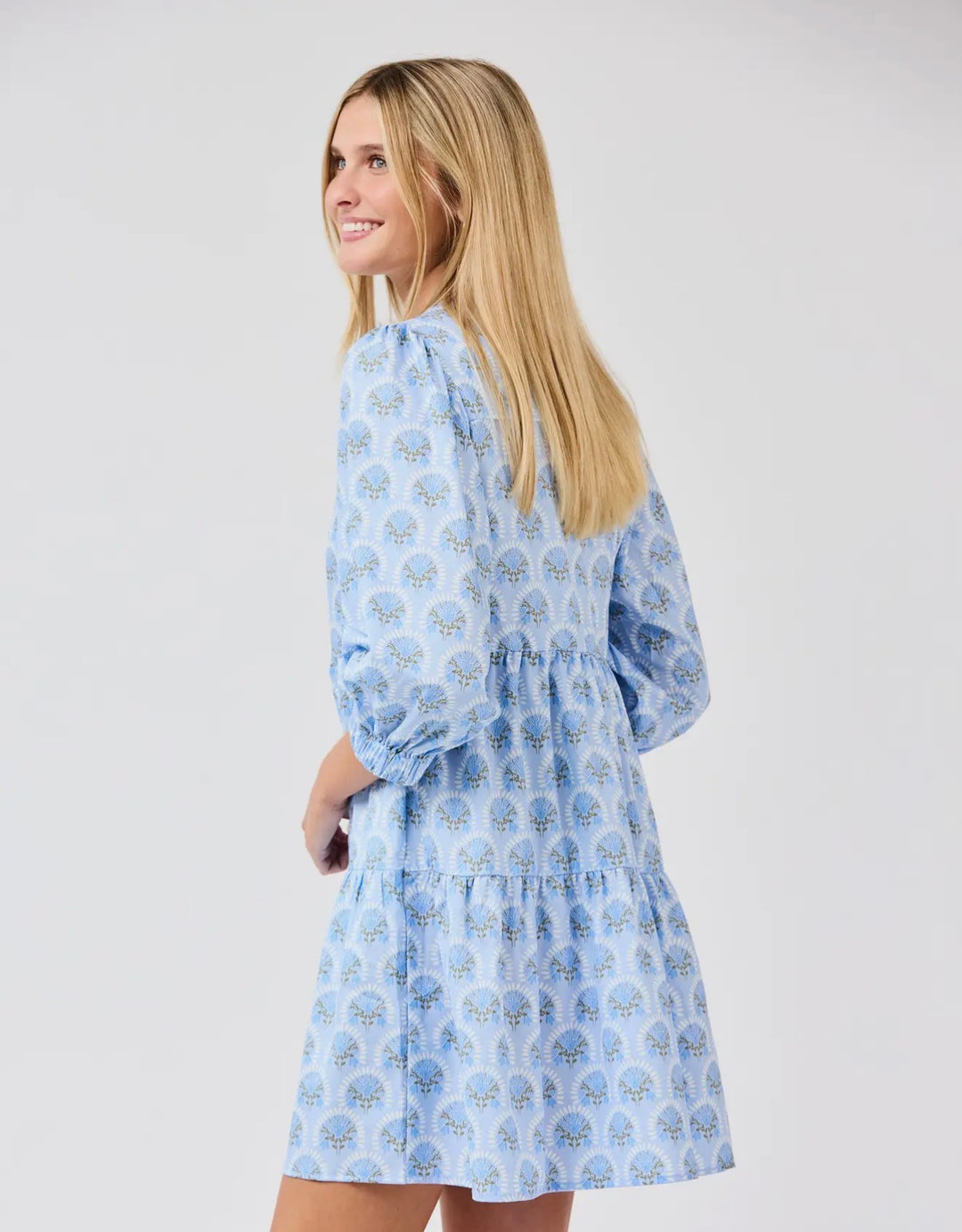 Cooper Botanical Blooms Dress: light blue, patterned V-neck, three-quarter sleeves, tiered skirt. Sizes XS–XL.
