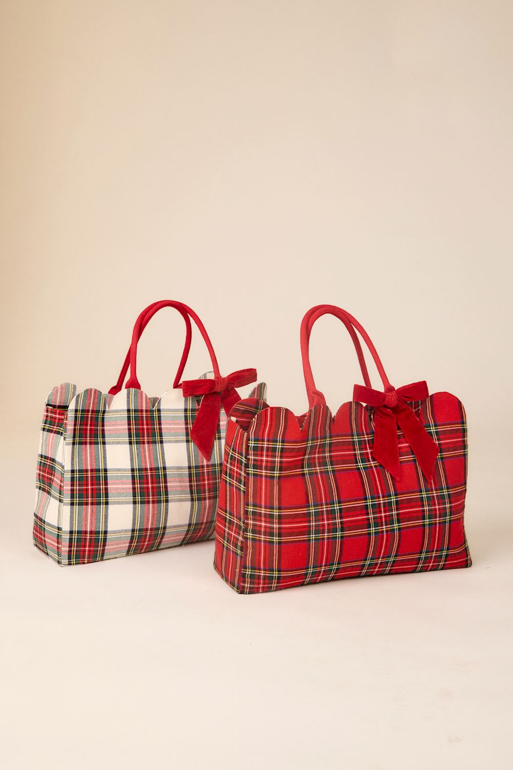 Two Velvet Bow Tartan Tote bags with scalloped edges, red handles, and velvet bows.