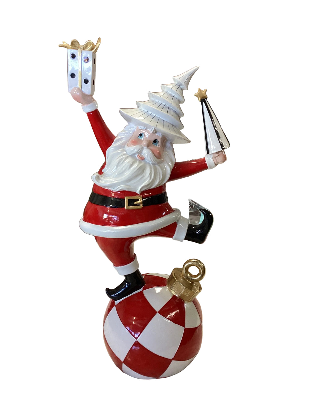 Whimsical Santa figurine with a tiered white hat, holding a gift box and stylized Christmas tree.