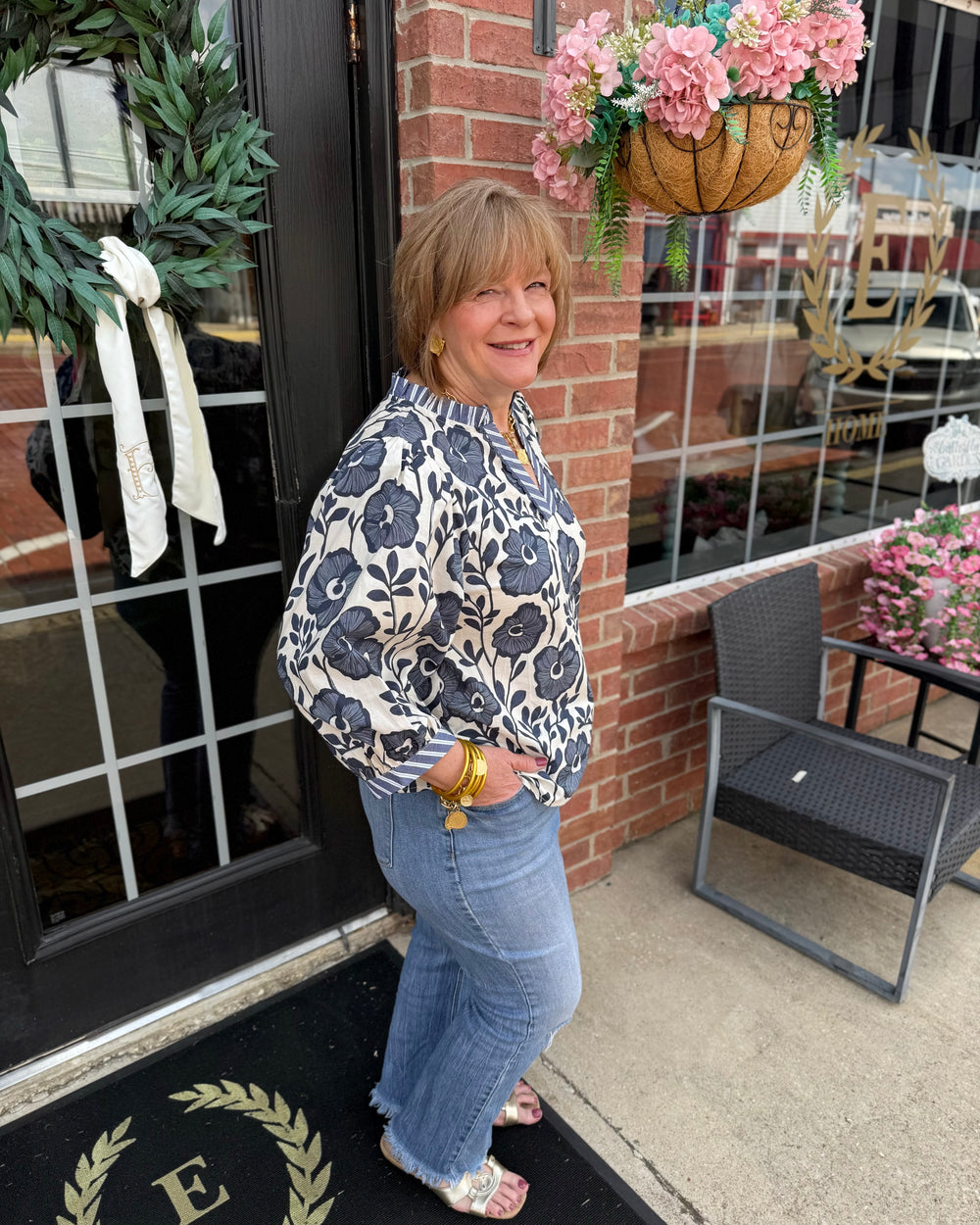 Bonnie Ruffle Floral Blouse featuring ruffled sleeves and floral print. Available in sizes XS–XL.