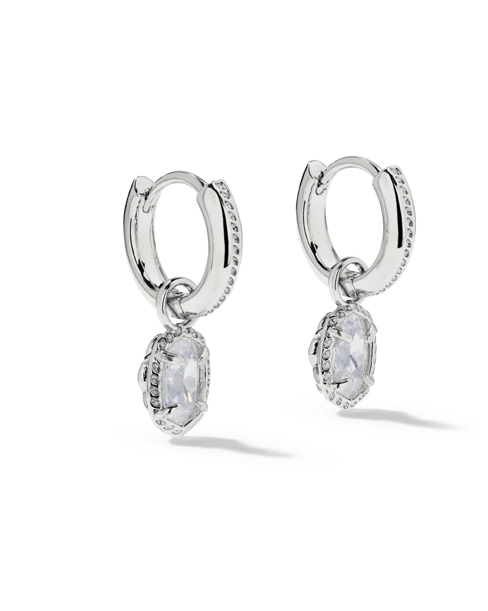 Silver Mini Ella Luxe Huggie CZ Earrings with oval-cut white stone drops and clear stone accents.