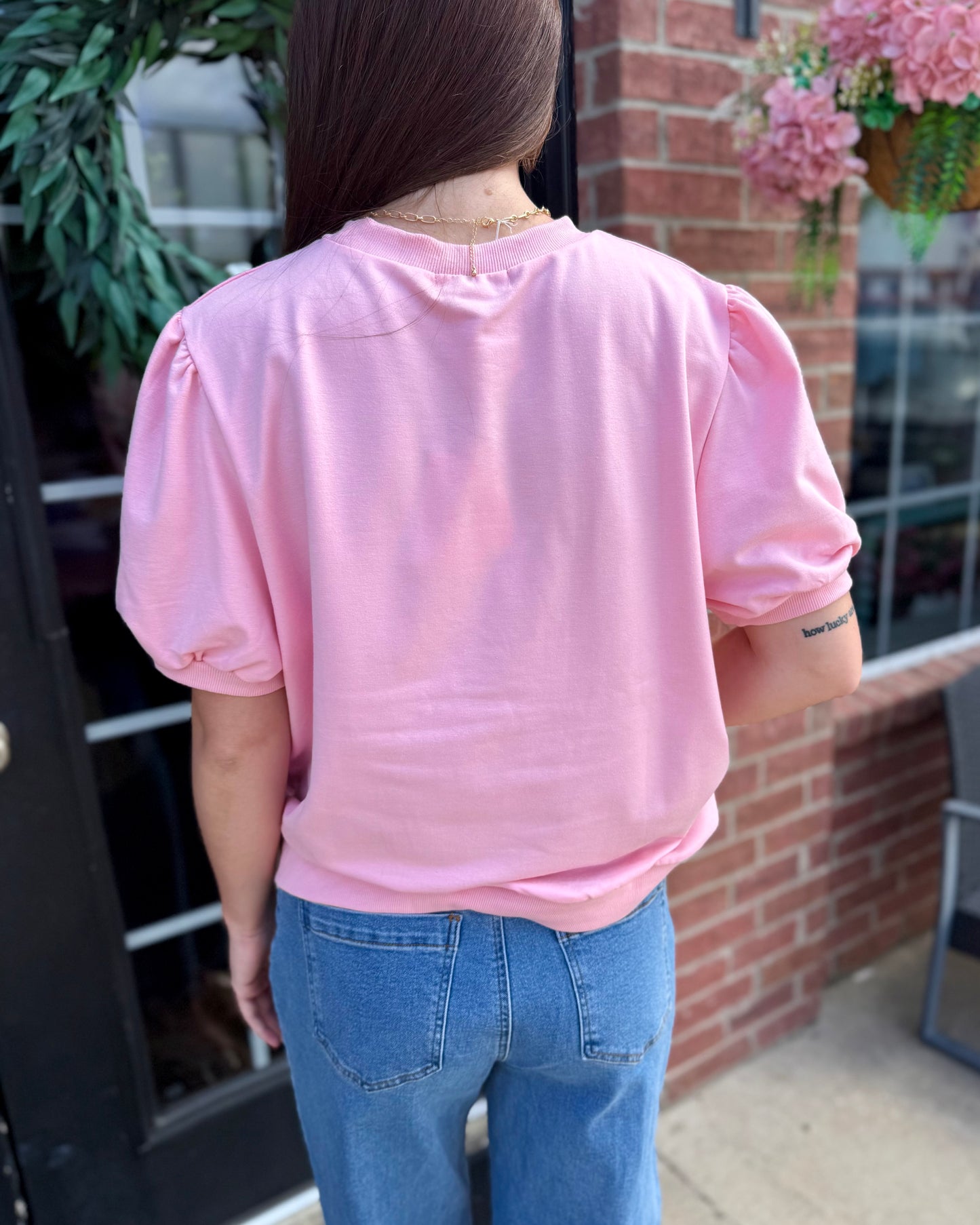 Pink Pumpkin Short Sleeve Sweatshirt in light pink; available in sizes S-XXL.