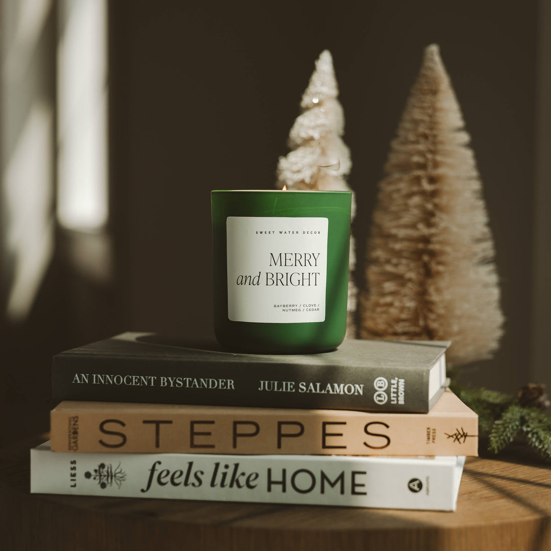 Green Merry and Bright 15 oz Soy Candle, Matte, with a white “Merry and Bright” label.