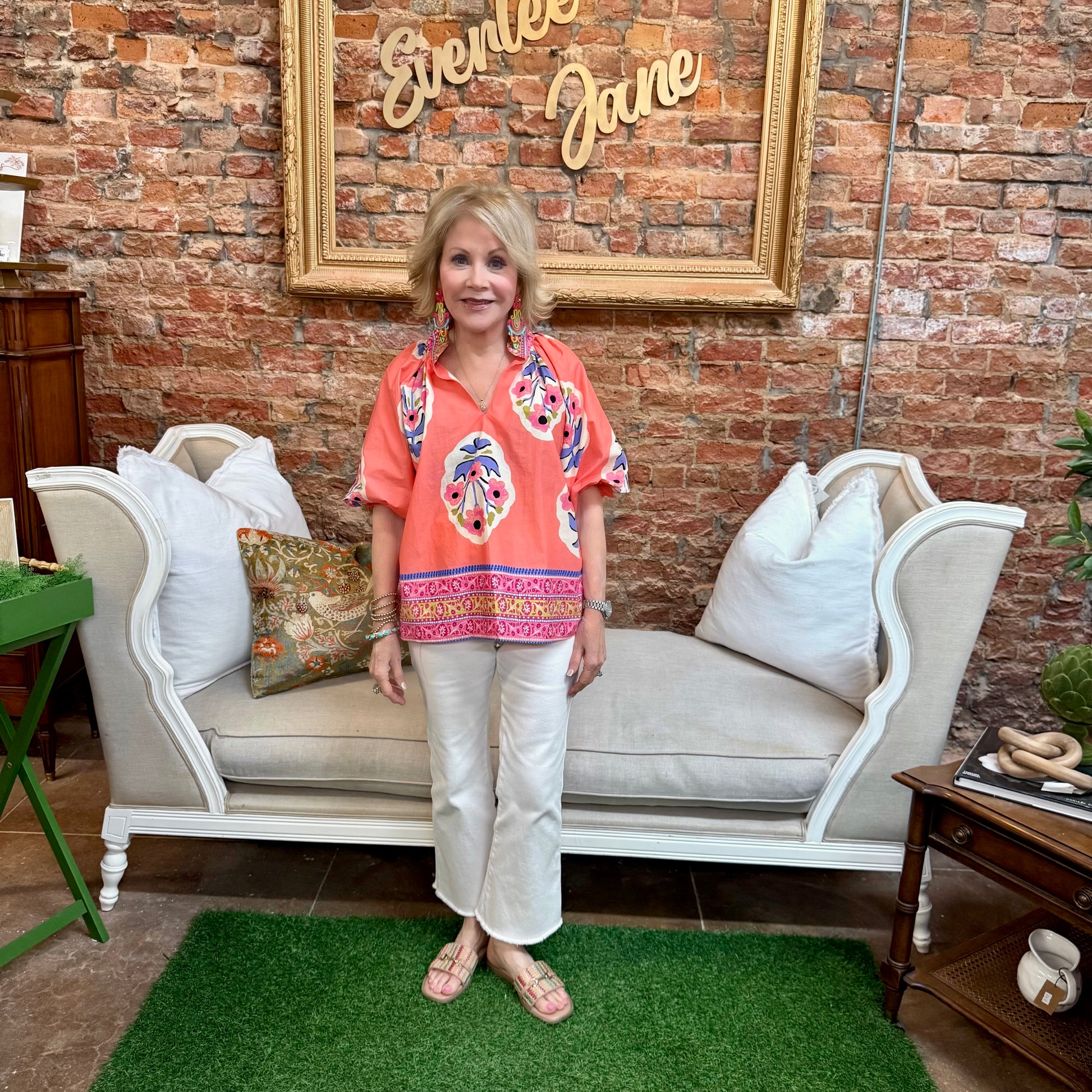 Sunset Floral Embroidery Top, featuring embroidered floral details. Available in sizes XS–XL.