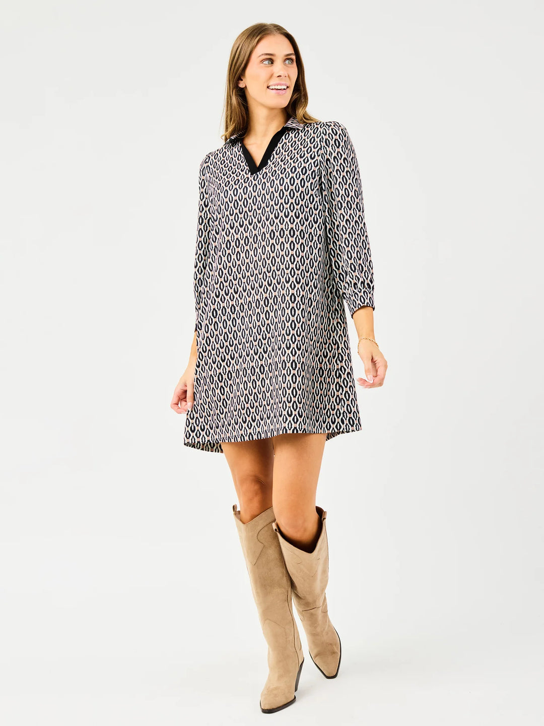 Raelyn High Notes Tan Dress: patterned, long sleeves, black collar, relaxed fit. Available in XS-XL.