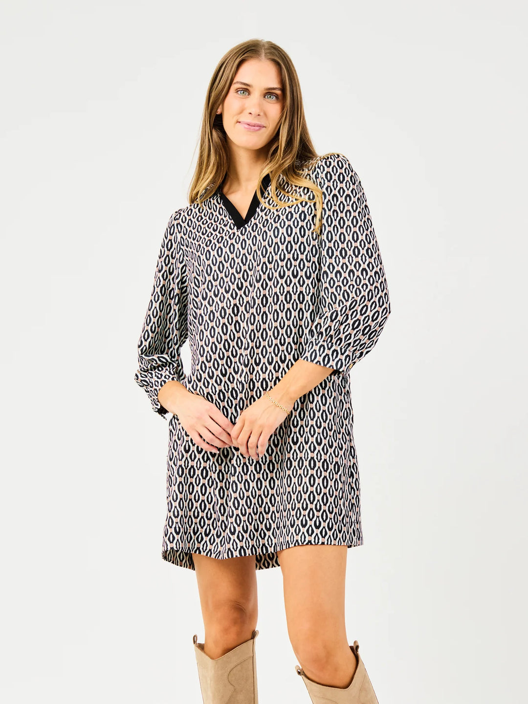 Raelyn High Notes Tan Dress: relaxed fit, long sleeves, black and white geometric pattern. Available in XS–XL.