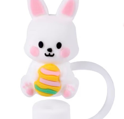 White bunny straw cover with pink cheeks and ears, holding pastel-colored egg stack. Available in multiple sizes.