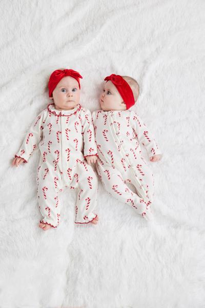 Two long-sleeved, zippered Candy Cane One Piece &amp; Headband sets with matching red headbands.