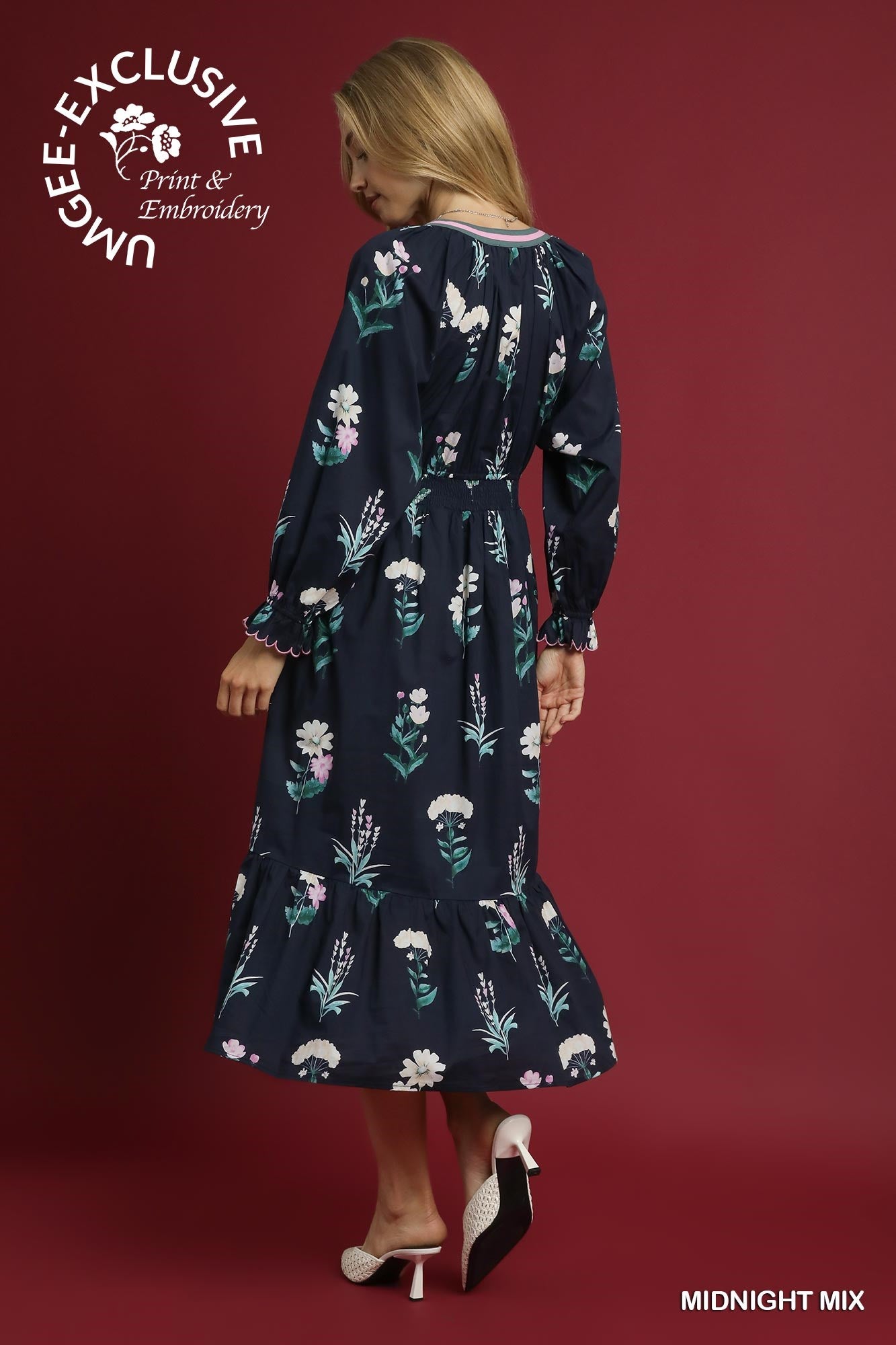 Navy long-sleeve floral midi dress with ruffle hem, "UNIQUEE EXCLUSIVE MIDNIGHT MIX." Available in XS-XL.
