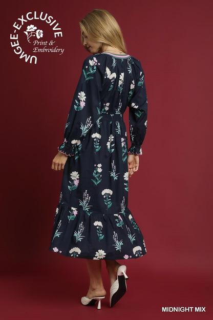 Navy long-sleeve floral midi dress with ruffle hem, "UNIQUEE EXCLUSIVE MIDNIGHT MIX." Available in XS-XL.