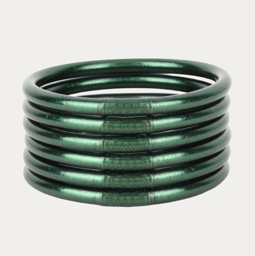 Six green metal bangles with a subtle engraved pattern, waterproof and shiny. Available in small, medium, and large sizes.