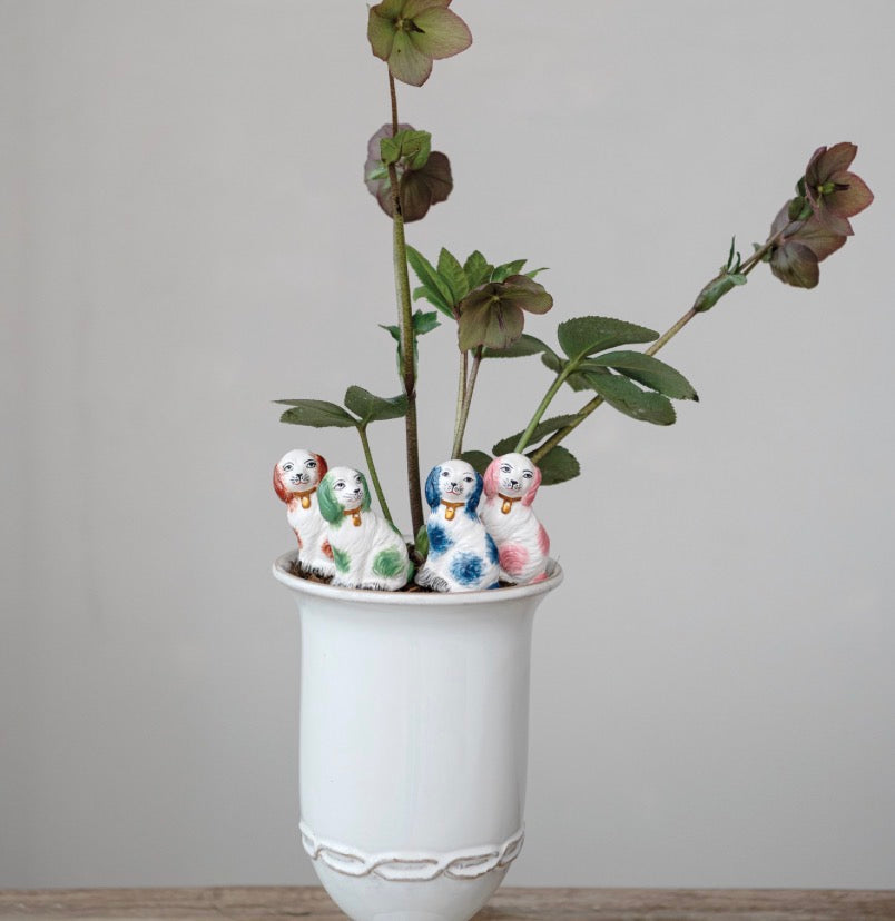 Set of four hand-painted Stoneware Plant Stake Dog figurines with colorful spots. Sizes available: small, medium, large, and extra-large.
