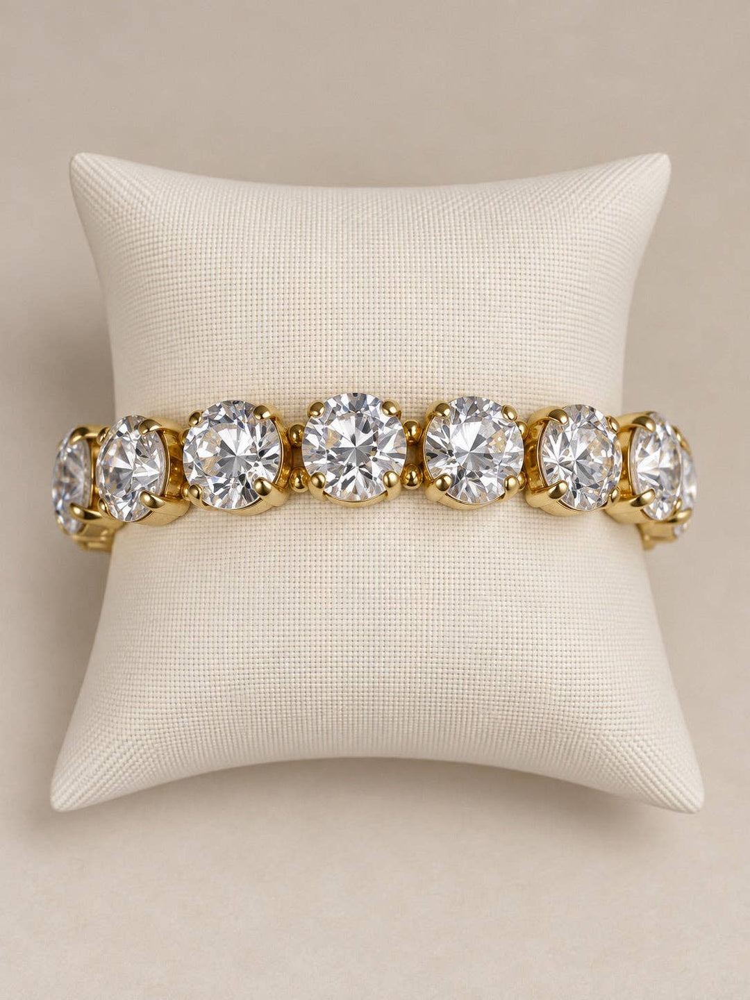 Gold-tone Gemmies stretch bracelet with oval and round clear stones.