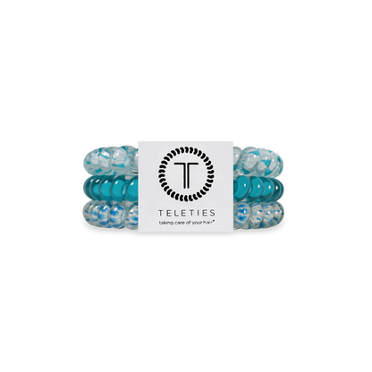 Three blue and clear TELETIES Hair Ties with branded card; available in small, medium, and large sizes.