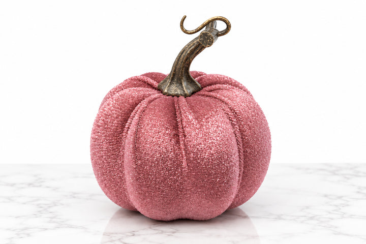 Pink velvet pumpkin with a curled metal stem.