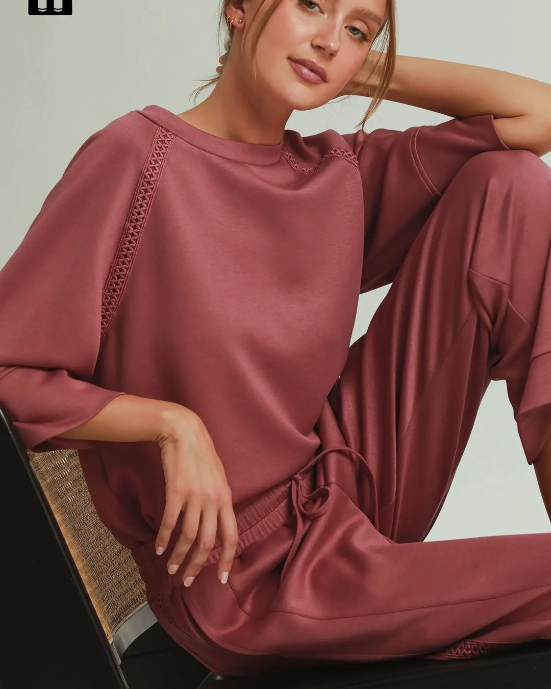 Relaxed-fit, rose-colored loungewear set with Butterfly Lace Straight Leg Pants and textured sleeve detailing. Sizes available: XS-XL.