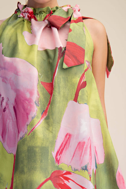 Mini Dress in Royal, size M. High neckline with tied bow, sleeveless, mini length, pink/red floral print on green. Sizes: M.