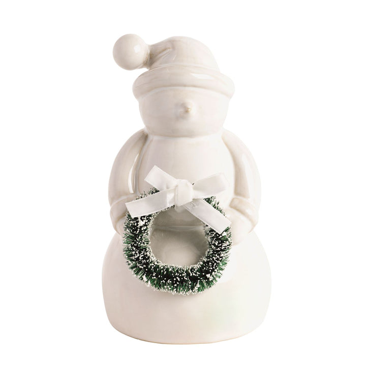 Ceramic snowman figurine holding a green wreath with a white bow.