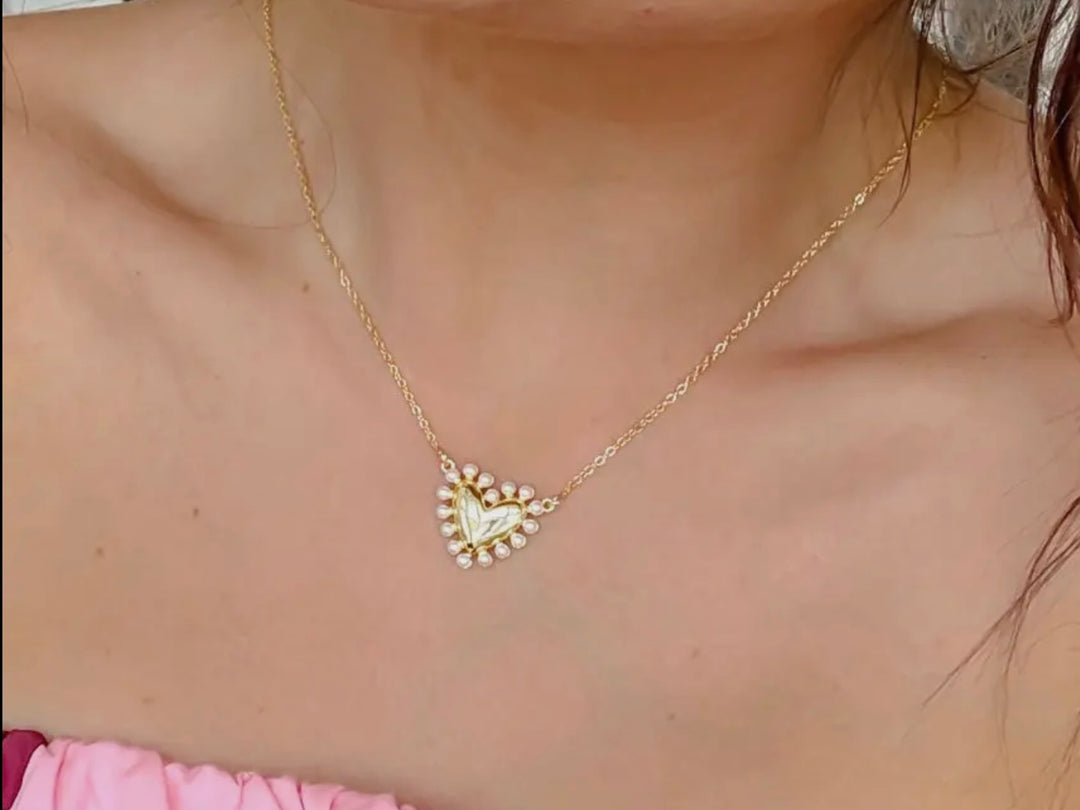 Love Gold Necklace: gold heart pendant encircled by petite pearls. Available in 16", 18", and 20" lengths.