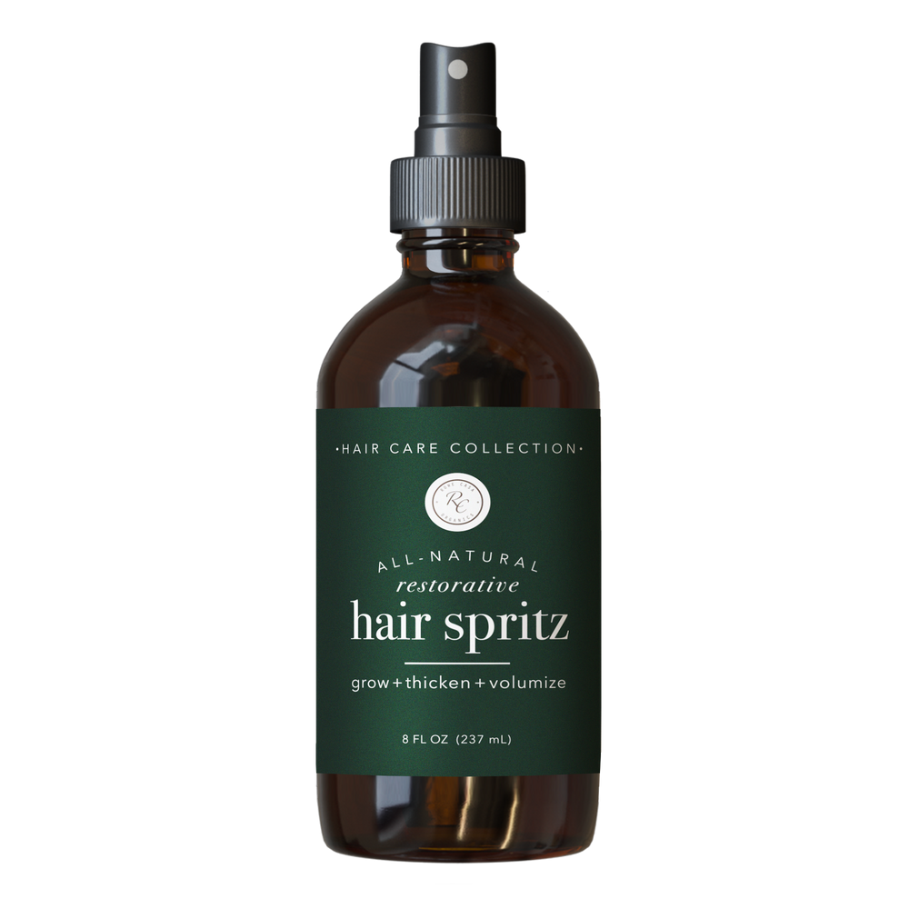 Brown 4 oz spray bottle labeled “Hair Spritz” with “grow + thicken + volumize”; supports hair growth and scalp health.