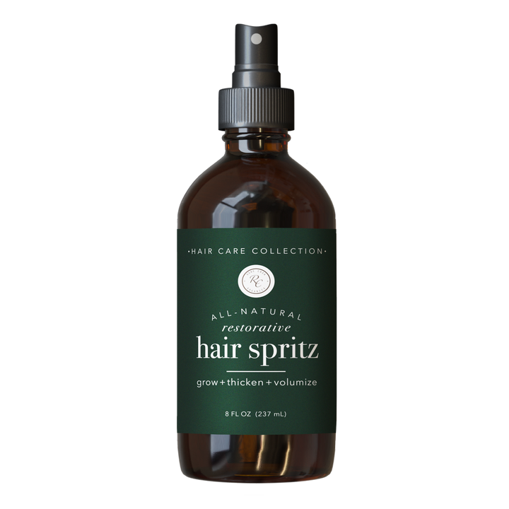 Brown 4 oz spray bottle labeled “Hair Spritz” with “grow + thicken + volumize”; supports hair growth and scalp health.