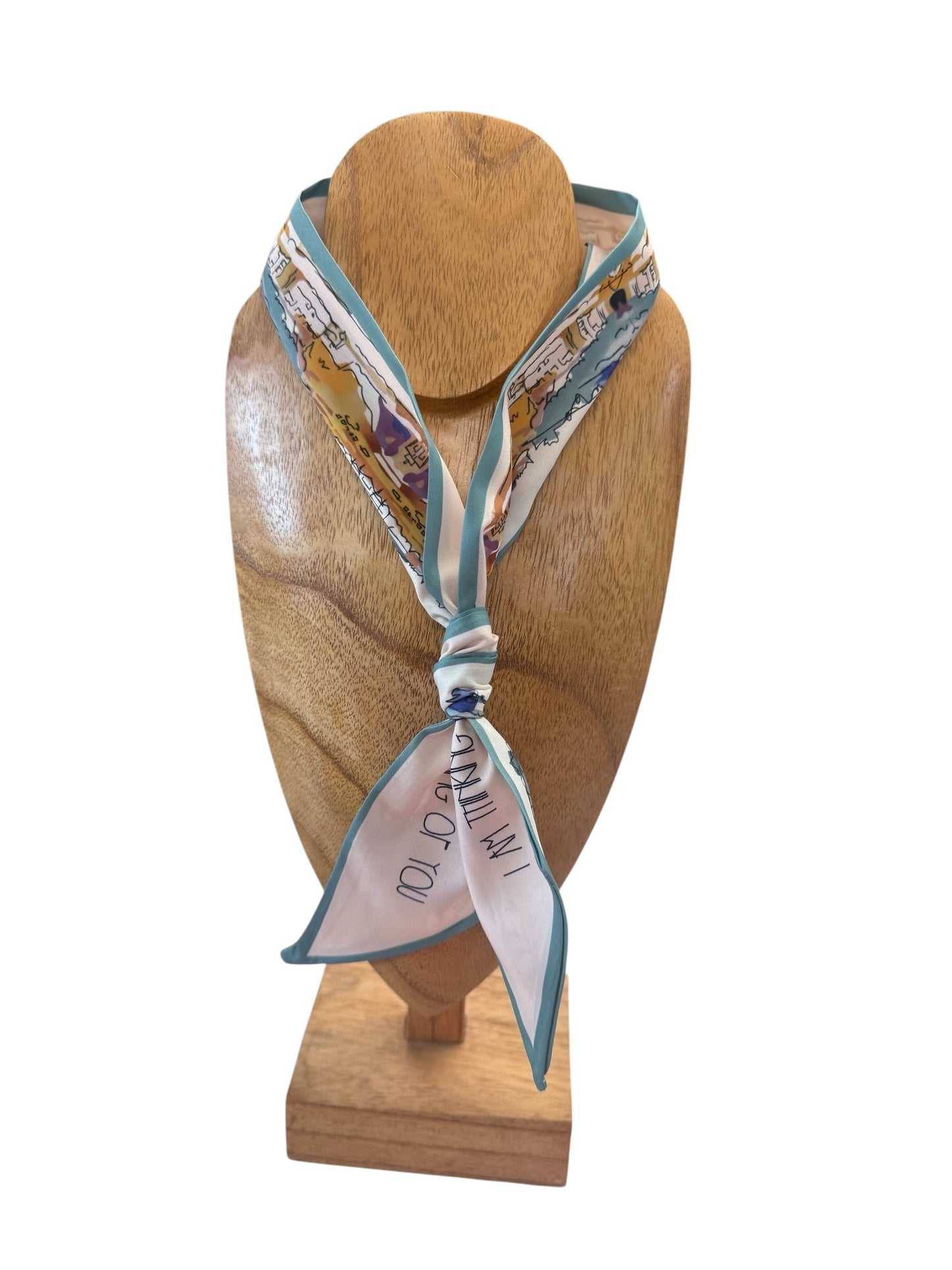Scarf Necklace with teal edges and "I do, I do" in black text. Multi-functional design. Available in S, M, L.