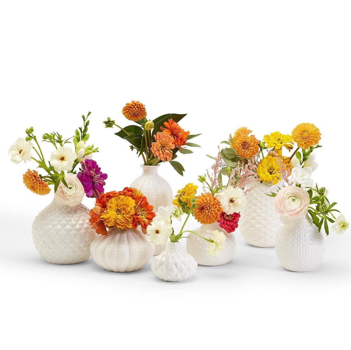 Artisan Carved Vase: small white ceramic, available in multiple sizes.