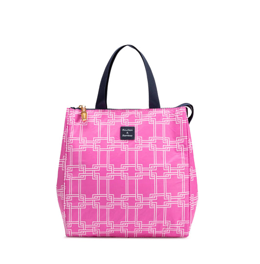 Pink tote with white geometric pattern, black handles, gold zipper, small front label; insulated. Sizes: small, medium, large.