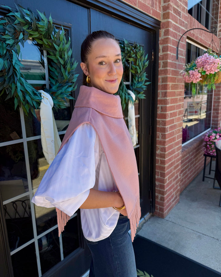 Blush pink collar poncho with fringe trim. Available in sizes S-L.